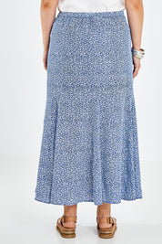 Model Jess wearing size 14 of the Nothing But Blue Skies Skirt in colour Bluefleur (Blue), from the back