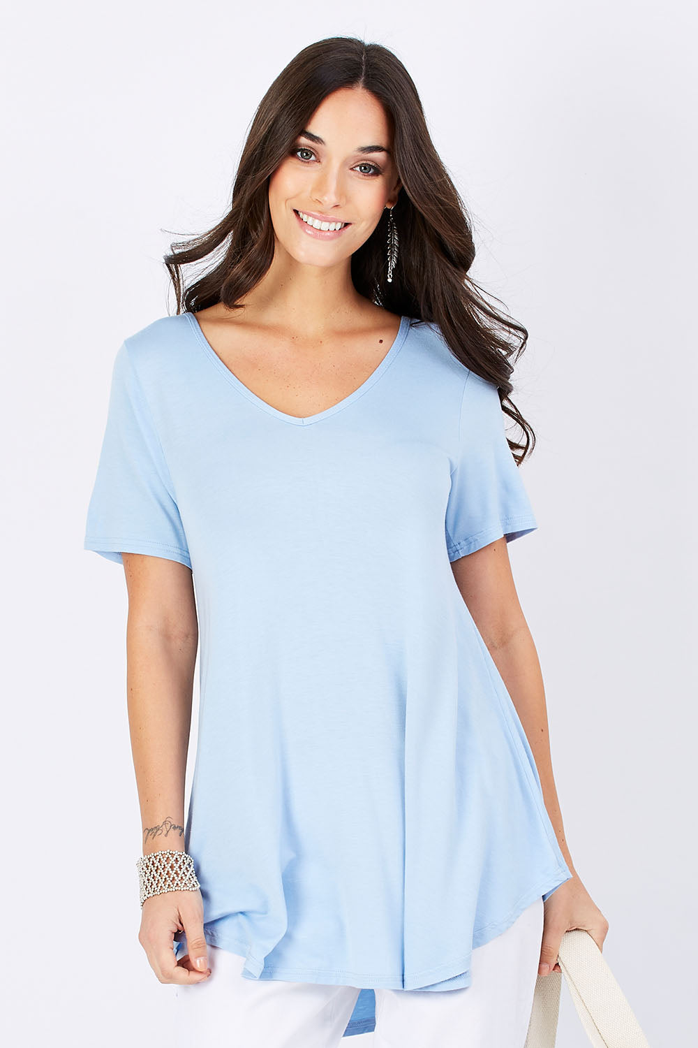 Model Georgia wearing size 10 of the Softly Swinging Bamboo Tee in colour Chambray (Blue), from the front, cropped image