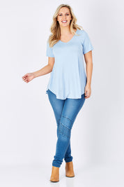 Model Jess wearing size 12 of the Softly Swinging Bamboo Tee in colour Chambray (Blue), from the front, showing the whole outfit