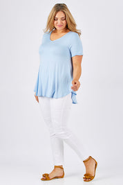 Model Ljubenka wearing size 18 of the Softly Swinging Bamboo Tee in colour Chambray (Blue), from the front, showing the whole outfit