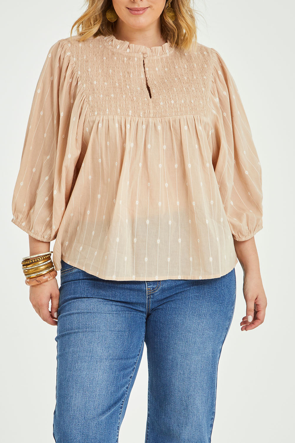 Model Jess wearing size 14 of the Delighted To Meet You Blouse in colour Sand, from the front, cropped image
