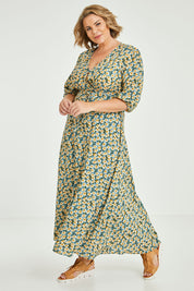 Model Fiona wearing size 16 of the Daisy Chain Swing Dress in colour Daisy (Blue), from the front, showing the whole outfit