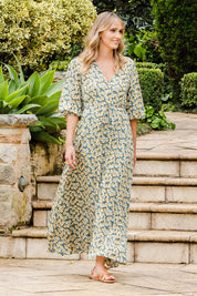 Model Tegan wearing size 10 of the Daisy Chain Swing Dress in colour Daisy (Blue), from the front, showing the whole outfit
