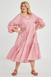 Model Keeara wearing size 16 of the Light Of The Sun Cotton Dress in colour Pinkfleur (Pink), from the front, showing the whole outfit
