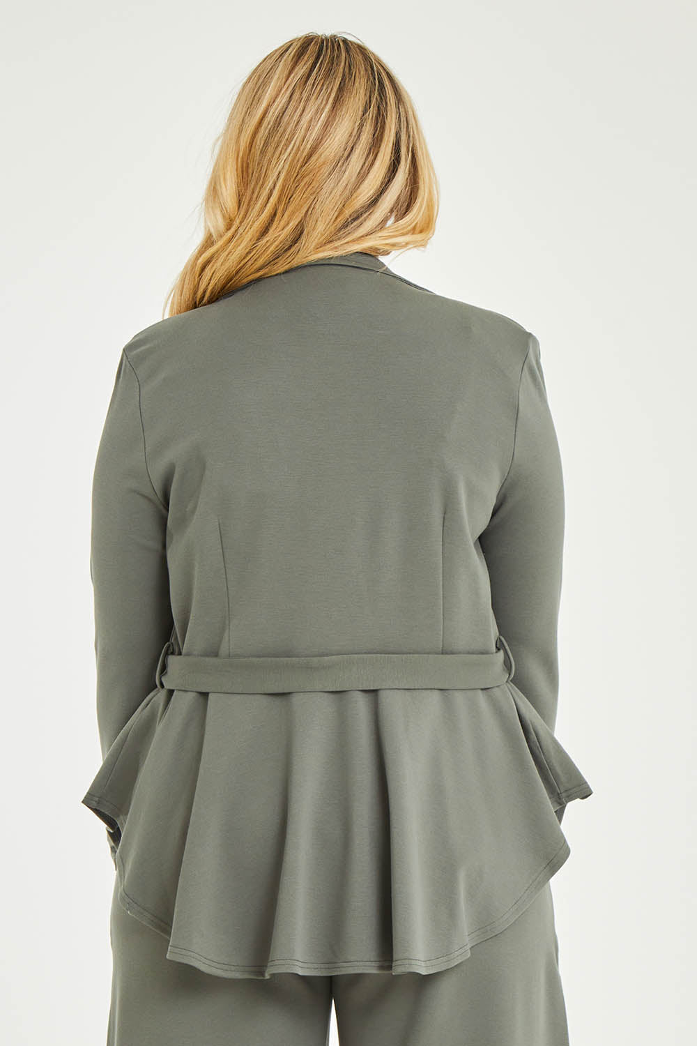 Model Katie wearing size 16 of the Femme Fatale Ponte Jacket in colour Moss (Green), from the back