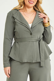 Model Katie wearing size 16 of the Femme Fatale Ponte Jacket in colour Moss (Green), from the front, cropped image