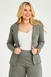 Model Katie wearing size 16 of the Femme Fatale Ponte Jacket in colour Moss (Green), from the front, cropped image