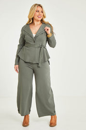 Model Katie wearing size 16 of the Femme Fatale Ponte Jacket in colour Moss (Green), from the front, showing the whole outfit