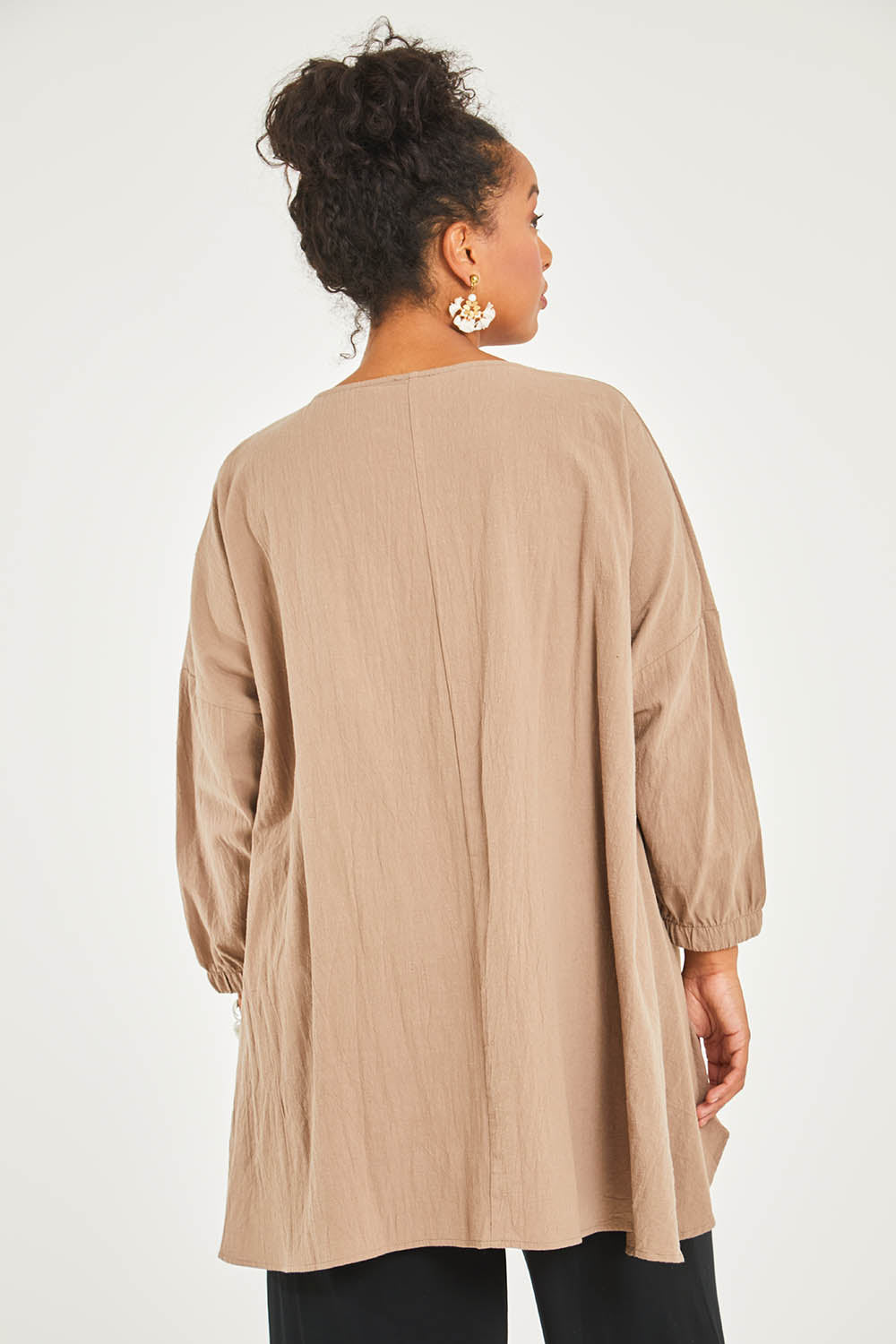 Model Noli wearing size 14 of the Good Times Gather Top in colour Latte, from the back