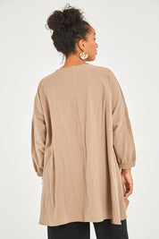 Model Noli wearing size 14 of the Good Times Gather Top in colour Latte, from the back