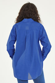 Model Noli wearing size 14 of the Relaxed Elegance Boyfriend Shirt in colour Cobalt (Blue), from the back