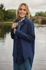 Model Tegan wearing size 10 of the Relaxed Elegance Boyfriend Shirt in colour Inknavy (Blue), from the front, showing the whole outfit