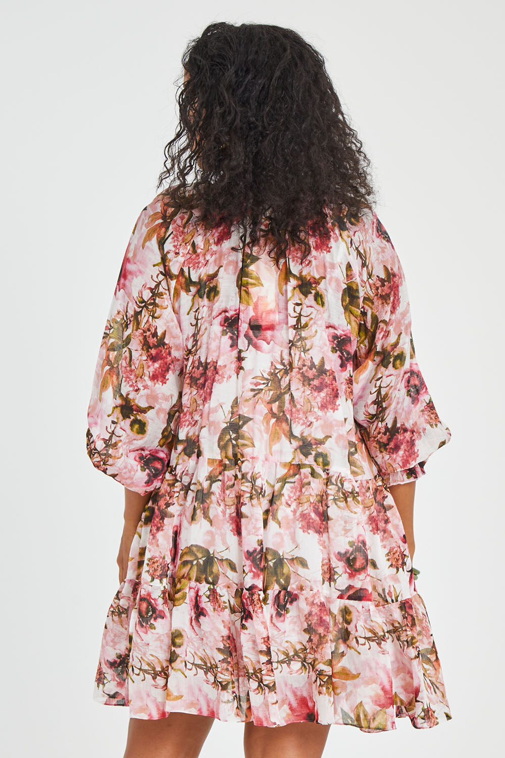 Model Noli wearing size 14 of the Down The Garden Path Dress in colour Fleur (Pink), from the back