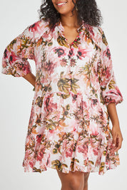 Model Noli wearing size 14 of the Down The Garden Path Dress in colour Fleur (Pink), from the front, cropped image