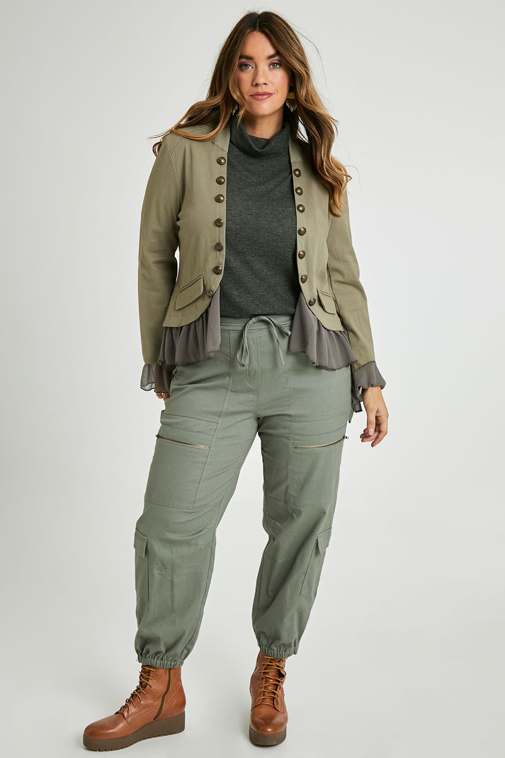 Model Laura wearing size 14 of the I Can Do It Myself Carpenter Cargos in colour Khaki (Green), from the front, showing the whole outfit