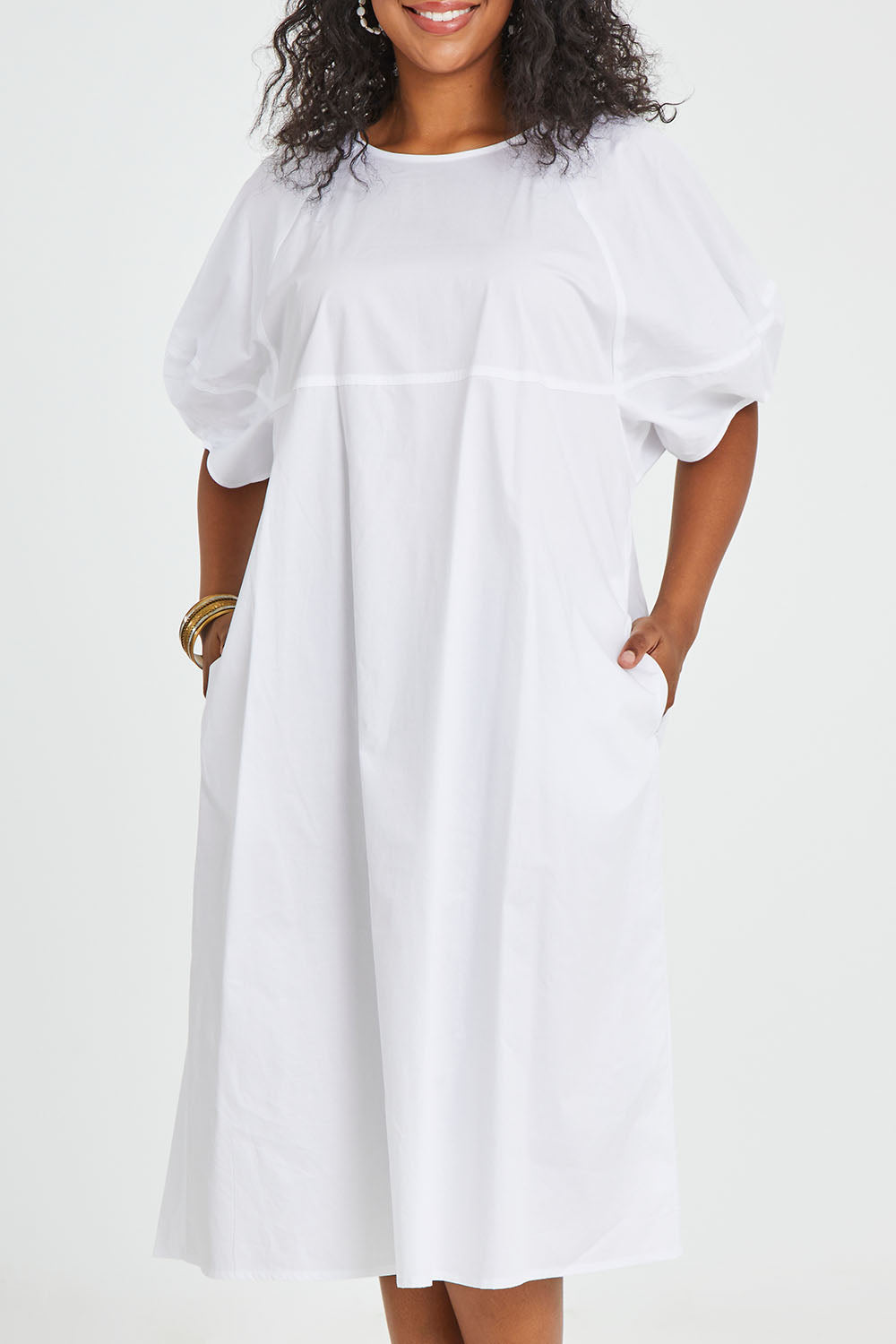Model Noli wearing size 14 of the Light The Way Lantern Sleeve Dress in colour White (White), from the front, cropped image