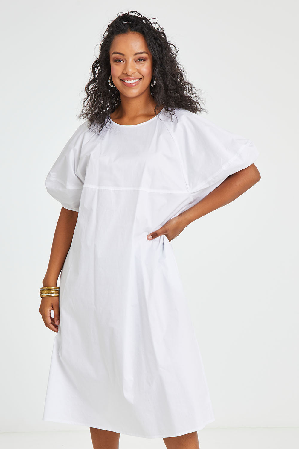 Model Noli wearing size 14 of the Light The Way Lantern Sleeve Dress in colour White (White), from the front, cropped image