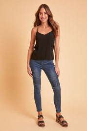 Model Madeline wearing size 10 of the Wild Plains Flat Front Stitch Jeggings in colour Darkdenim (Blue), from the front, showing the whole outfit