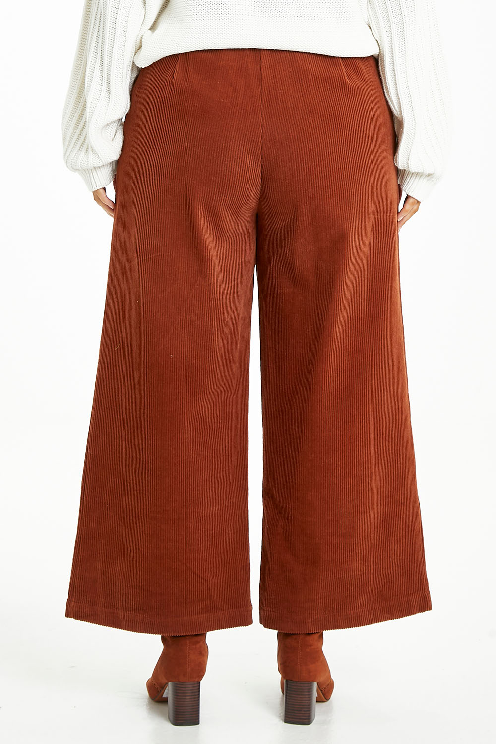 Model Laura wearing size 14 of the Feeling Good Wide Leg Cord Pants in colour Rust, from the back