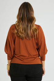 Model Laura wearing size 14 of the Ive Got This Top in colour Toffee, from the back