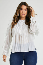 Model Laura wearing size 14 of the Ruffled Feathers Blouse in colour White (White), from the front, cropped image