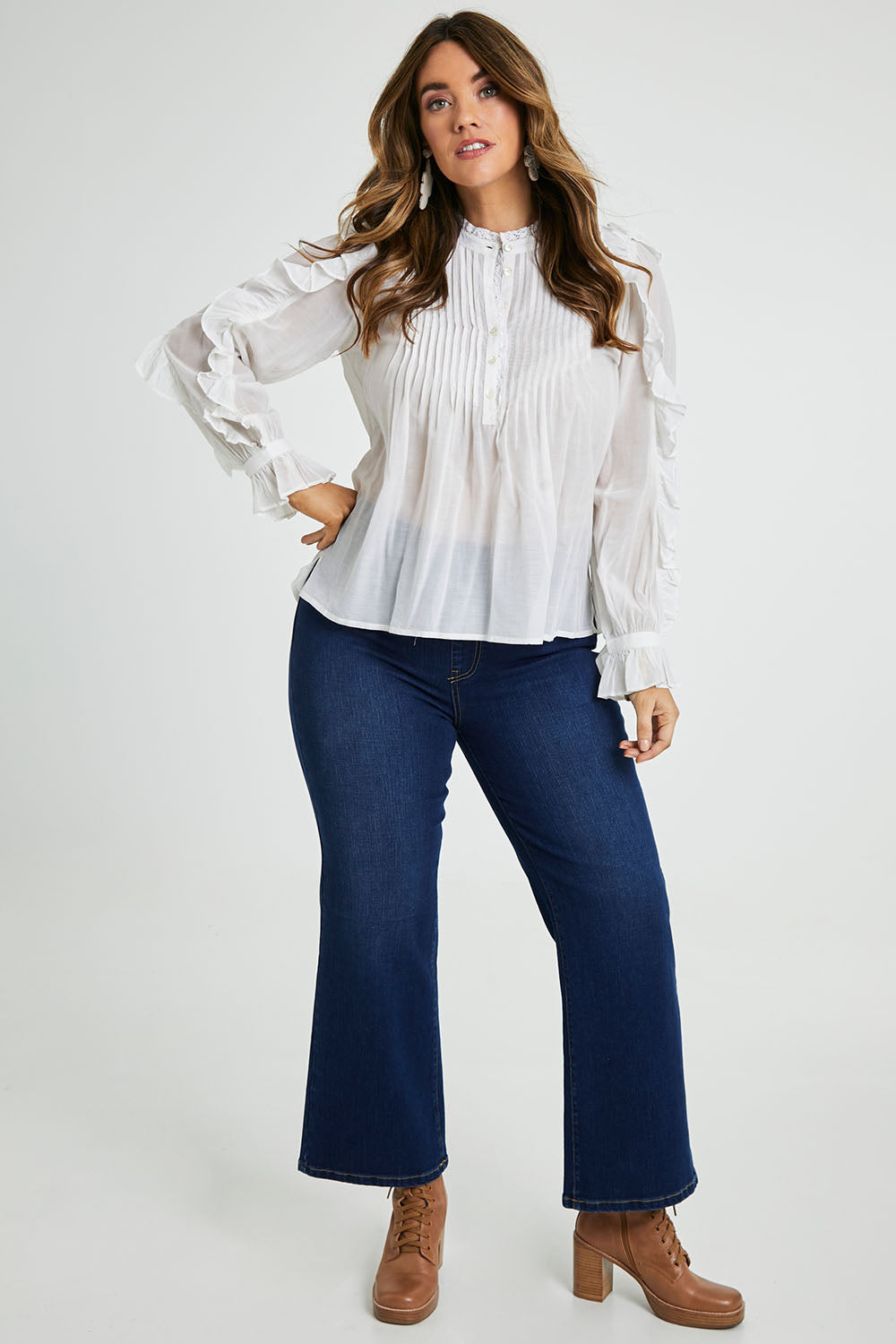 Model Laura wearing size 14 of the Ruffled Feathers Blouse in colour White (White), from the front, showing the whole outfit
