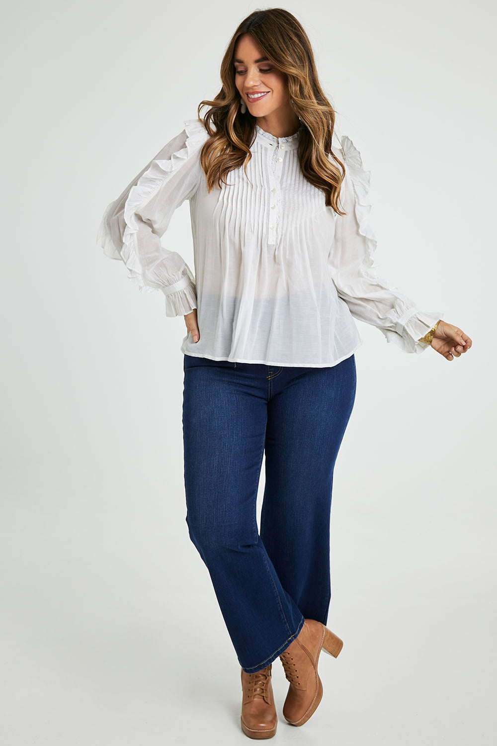 Model Laura wearing size 14 of the Ruffled Feathers Blouse in colour White (White), from the front, showing the whole outfit