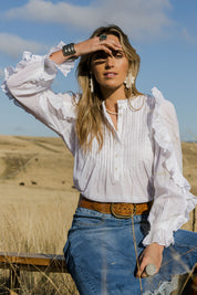 Model Tegan wearing size 10 of the Ruffled Feathers Blouse in colour White (White), from the front, showing the whole outfit