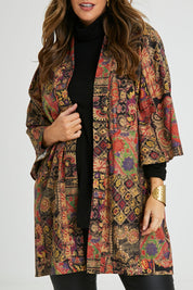 Model Laura wearing size 14 of the You Colour My World Long Kimono in colour Patchprint (Black), from the front, cropped image