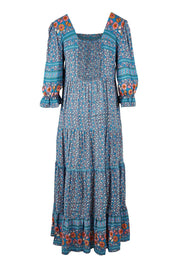Product shot of the Paradise Found Maxi Dress in colour Denimfleur (Blue), from the back