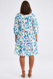 Model Monique wearing size 14 of the Chasing Blue Sky Cotton Dress in colour Blueleaf (Blue), from the back