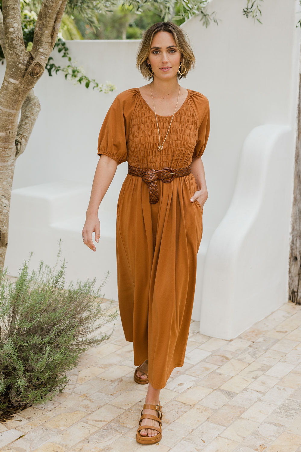 Model Tegan wearing size 10 of the Casual Friday Dress in colour Rust, from the front, showing the whole outfit