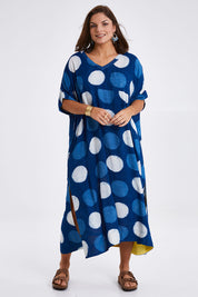 Model Monique wearing size 14 of the Beautiful Travels Dress in colour Indigo (Blue), from the front, showing the whole outfit