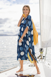 Model Tegan wearing size 10 of the Beautiful Travels Dress in colour Indigo (Blue), from the front, showing the whole outfit