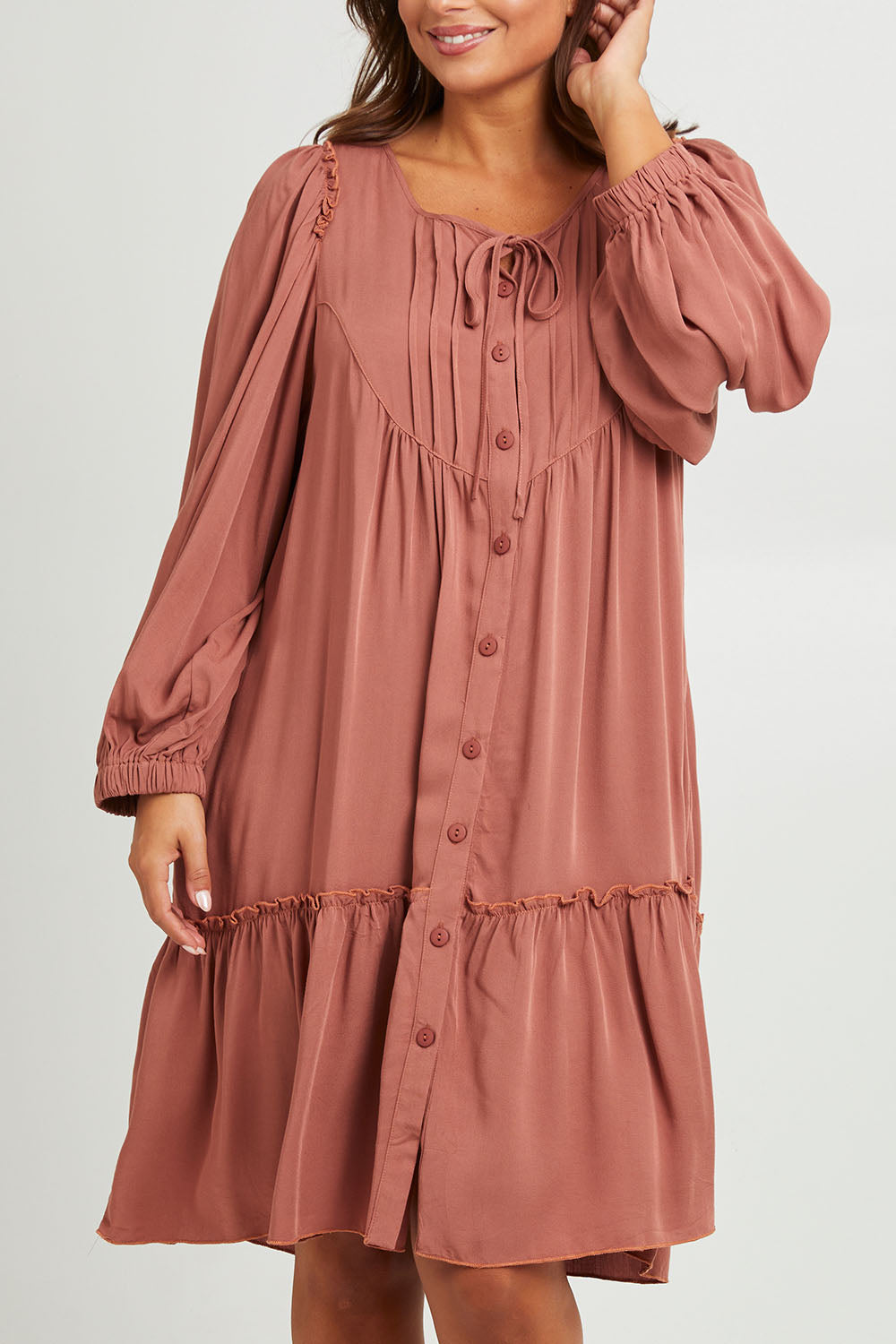 Model Monique wearing size 14 of the Ready For Any Adventure Dress in colour Cinnamon (Red), from the front, cropped image