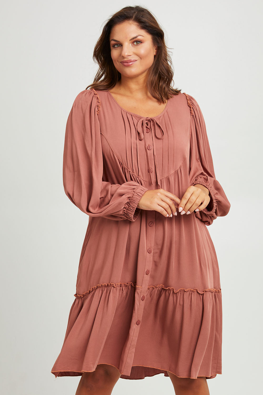 Model Monique wearing size 14 of the Ready For Any Adventure Dress in colour Cinnamon (Red), from the front, cropped image