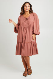 Model Monique wearing size 14 of the Ready For Any Adventure Dress in colour Cinnamon (Red), from the front, showing the whole outfit