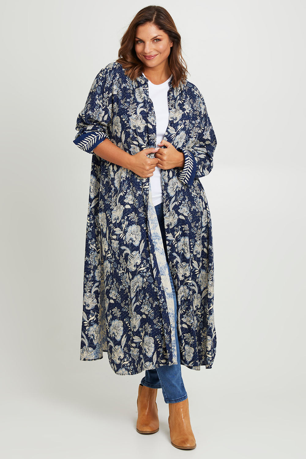 Model Monique wearing size 14 of the Swept Away By You Duster Blouse in colour Bluefleur (Blue), from the front, showing the whole outfit