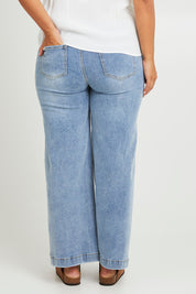 Model Monique wearing size 14 of the Always There For Me Boyfriend Jeans in colour Denim (Blue), from the back
