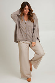 Model Laura wearing size L of the My Boyfriends Wool Cashmere Cardi in colour Stone, from the front, showing the whole outfit