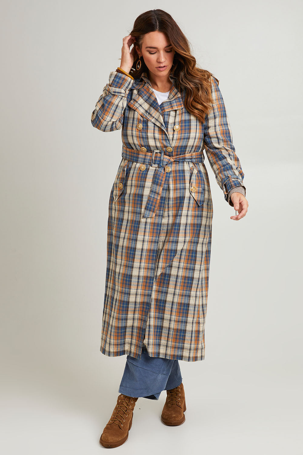 Model Laura wearing size 14 of the Check Me Out Trench Coat in colour Bluecheck (Blue), from the front, showing the whole outfit