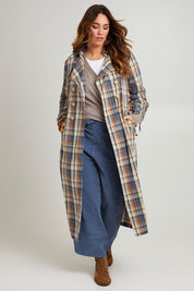 Model Laura wearing size 14 of the Check Me Out Trench Coat in colour Bluecheck (Blue), from the front, showing the whole outfit
