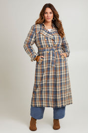 Model Laura wearing size 14 of the Check Me Out Trench Coat in colour Bluecheck (Blue), from the front, showing the whole outfit