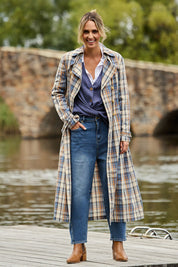 Model Tegan wearing size 10 of the Check Me Out Trench Coat in colour Bluecheck (Blue), from the front, showing the whole outfit