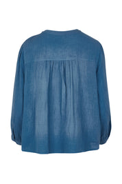 Product shot of the First Light Cotton Blouse in colour Dutchblue (Blue), from the back