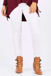 Model Emma wearing size 10 of the Wild West Stitched Jeggings in colour White (White), from the front, cropped image