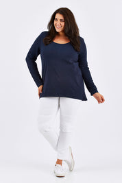 Model Mae wearing size 18 of the Wild West Stitched Jeggings in colour White (White), from the front, showing the whole outfit