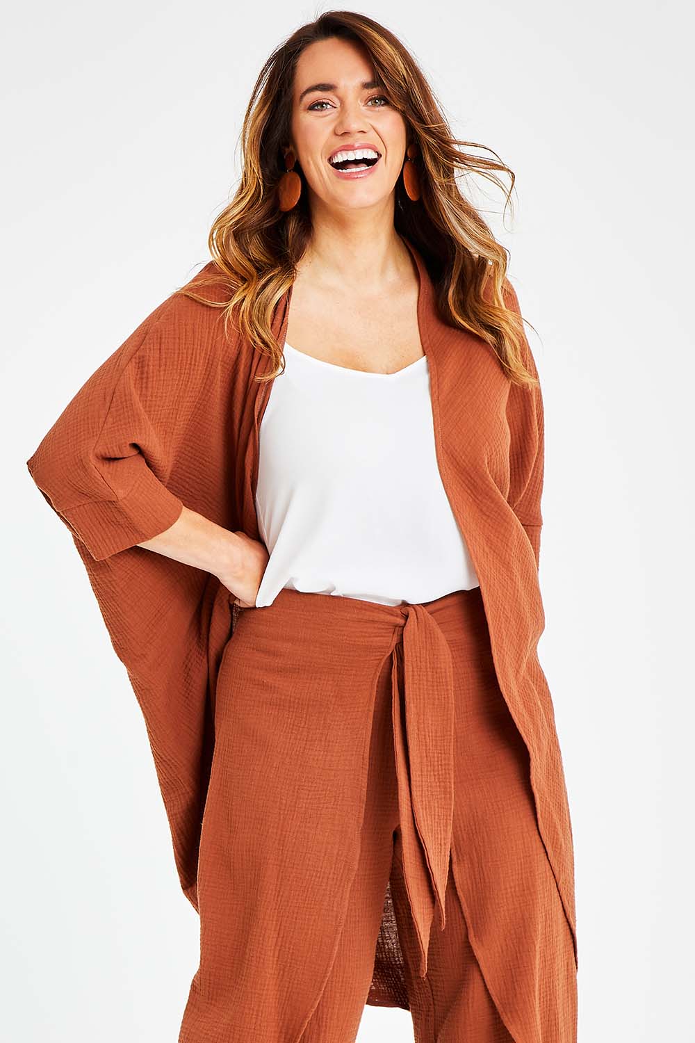 Model Laura wearing size 14 of the Falling For You Cotton Cardi in colour Cinnamon, from the front, cropped image