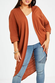Model Sasha-Lee wearing size 16 of the Falling For You Cotton Cardi in colour Cinnamon, from the front, cropped image