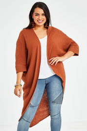 Model Sasha-Lee wearing size 16 of the Falling For You Cotton Cardi in colour Cinnamon, from the front, cropped image